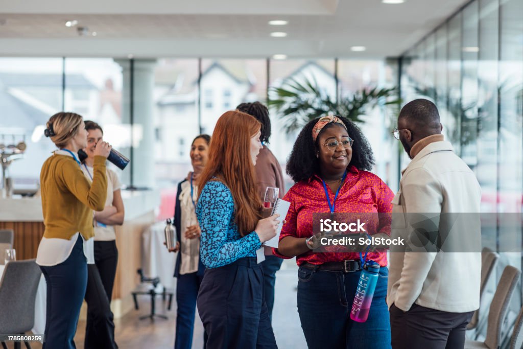 Networking Opportunities A wide angle view of a group of mixed age professionals who are taking advantage of a networking opportunity at a business conference in the North East of England. They are stood in smaller groups and getting to know each other during the networking getting to know you breaks of the conference. Some are carrying their water bottles and the others their notebooks and they are wearing their ID lanyards. Connection Stock Photo Networking Opportunities A wide angle view of a group of mixed age professionals who are taking advantage of a networking opportunity at a business conference in the North East of England. They are stood in smaller groups and getting to know each other during the networking getting to know you breaks of the conference. Some are carrying their water bottles and the others their notebooks and they are wearing their ID lanyards. Connection Stock Photo