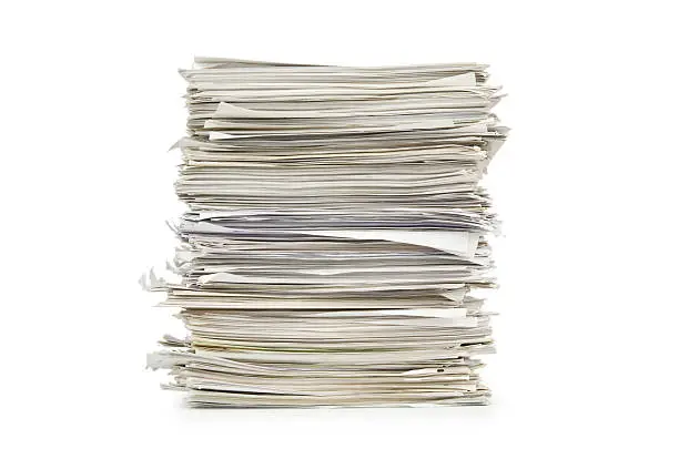 Photo of Large stack of papers on a white background