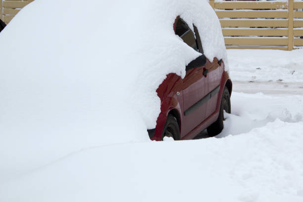 istock Parked car under snow cover. Winter parking background 1785810024