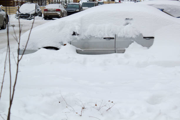 istock Parked car under snow cover. Winter parking background 1785810042