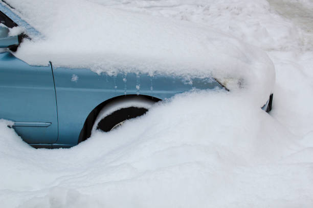 istock Parked blue car under snow cover. Winter parking background 1785810058