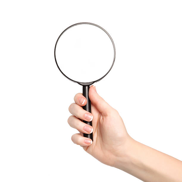 istock isolated woman hand holding a magnifying glass 178581305