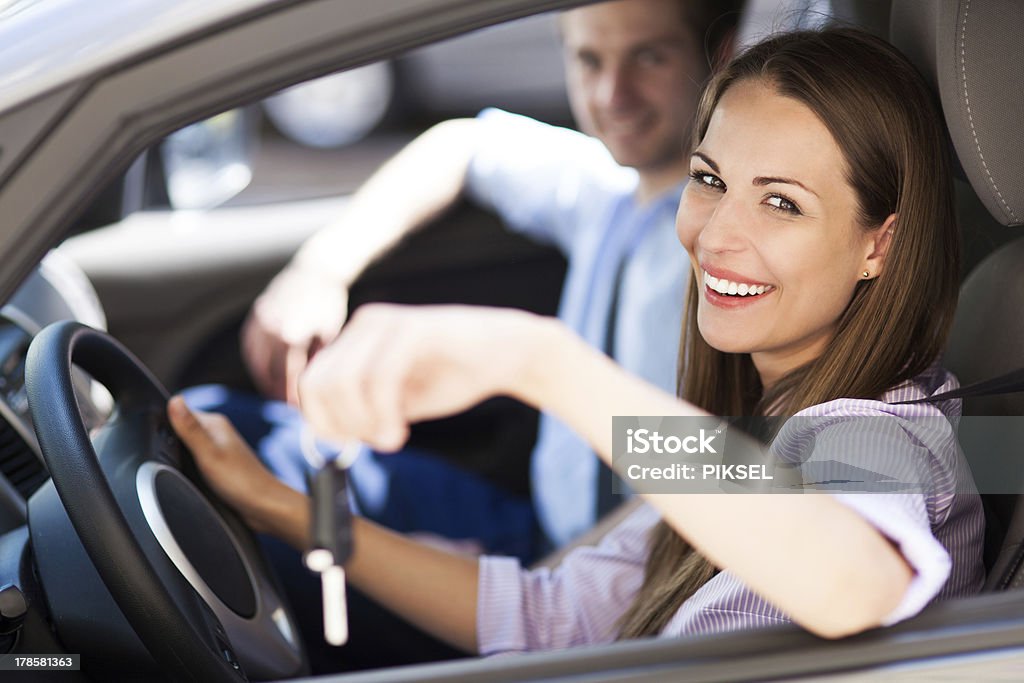 Young woman showing car keys Car Stock Photo