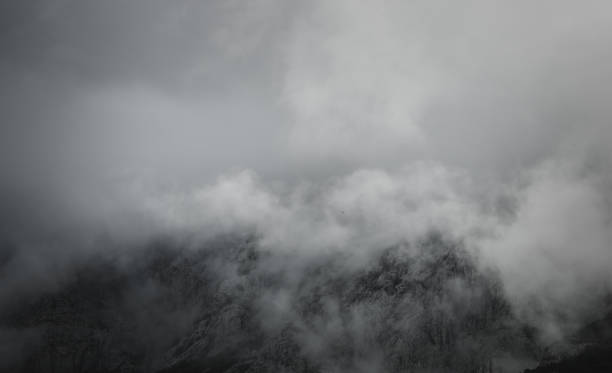 istock Dramatic clouds covering rocky mountains in Croatia 1785817534