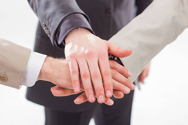 Pile of hands business team showing unity. stock photo