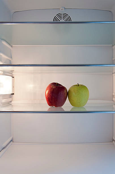 istock two apples on a shelf in the refrigerator 178582236