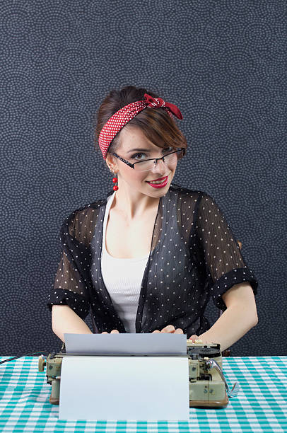 istock Pin up girl with typewriter 178582646