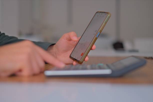 istock Close-up Woman using phone with blank screen at home 1785838589