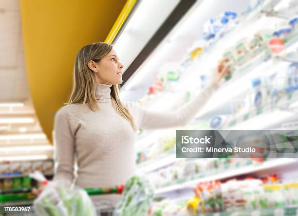 Woman In A Supermarket Stock Photo - Download Image Now - Cheese, Retail, Supermarket