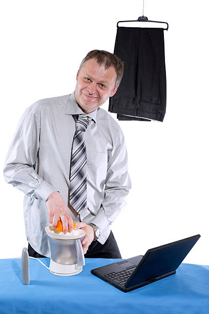istock happy businessman make orange juice 178584199