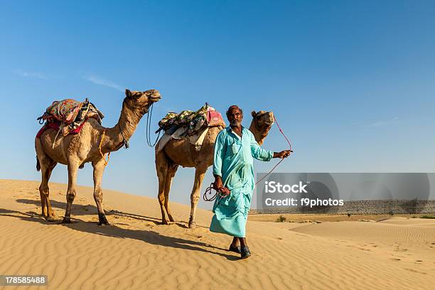 Cameleer With Camels In Dunes Of Rajasthan Stock Photo - Download Image Now