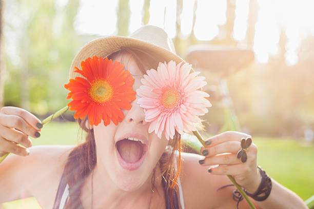 istock Young woman with flowers 178586326