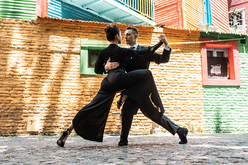 Street artist couple dancing tango on Caminito, Buenos Aires, Argentina