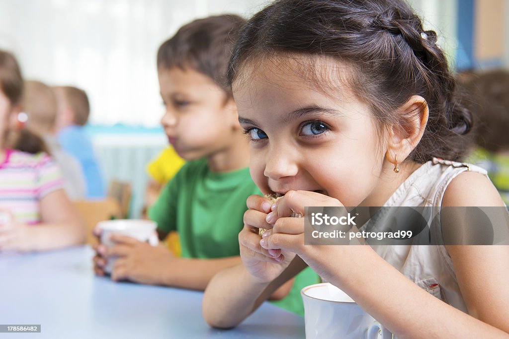 Cute little children drinking milk Cute little children drinking milk at daycare Child Stock Photo