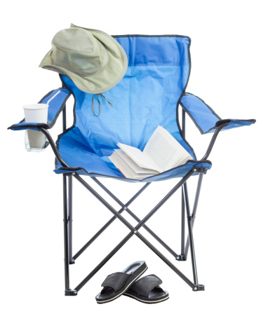 Blue folding camp chair isolated on white background.