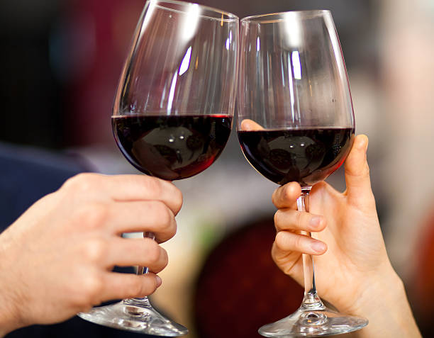 istock Couple toasting wine glasses 178587488