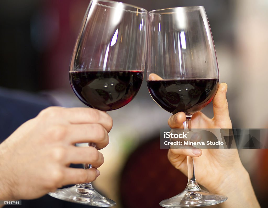 Couple toasting wine glasses Couple toasting wine glasses in an elegant restaurant Alcohol - Drink Stock Photo