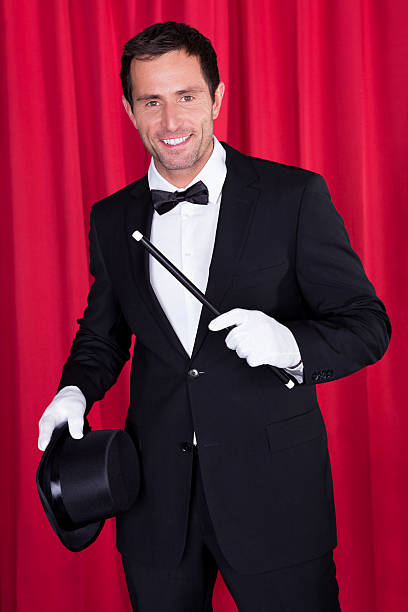 istock Young Magician In A Black Suit 178587768