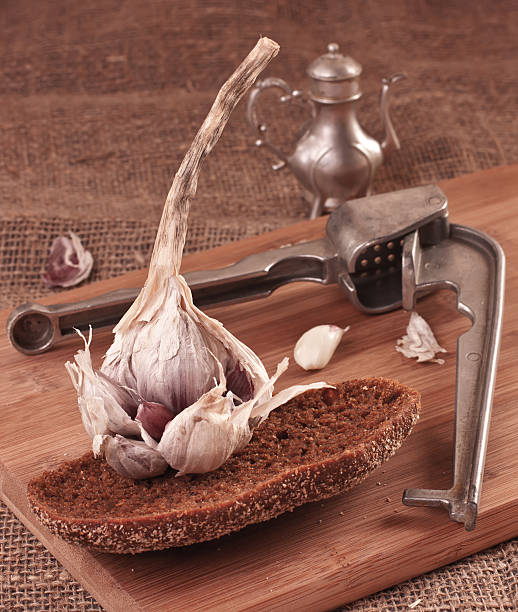 Garlic on Cutting Board stock photo