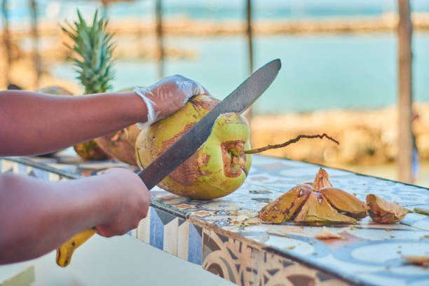 istock Tropical Craftsmanship: Crafting Cocoloco by the Sea at a Tiled Bar 1785880571