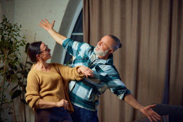 istock Happy cheerful cute couple having fun, laughing while spending time together, relaxing at home on weekend. Concept of cozy winter holidays 1785880596