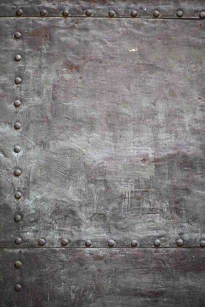 istock Black metal plate or armour texture with rivets 178588139