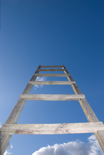 Ladder into dramatic sky