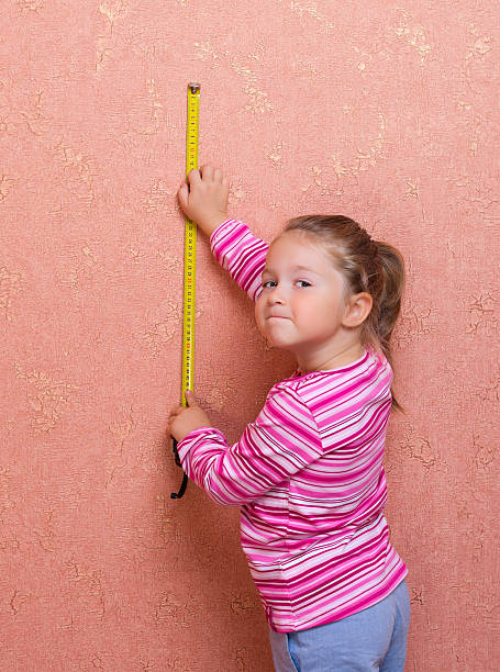 istock Little girl with measuring tape 178588958