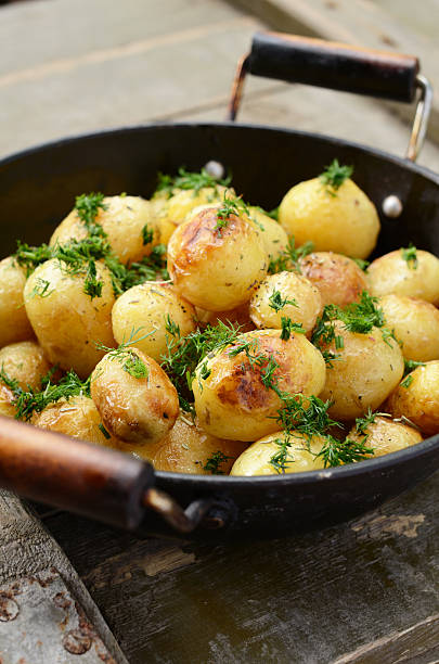 istock Whole fried potato in old wok 178589125