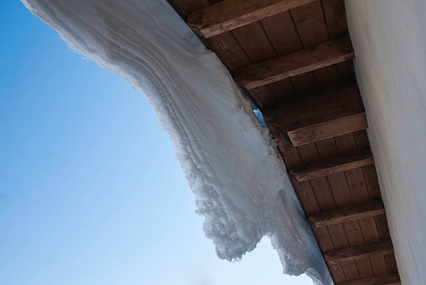 Snow drift on italian wood roof stock photo