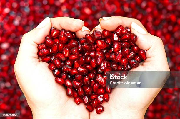 Pomegranate Seeds Shaping Heart In Hands Stock Photo - Download Image Now - Pomegranate, Heart Shape, Antioxidant