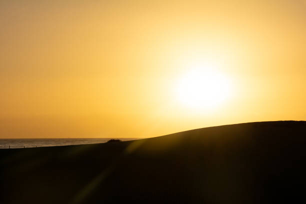 istock Sunrise over the sand dunes with sea 1785901237
