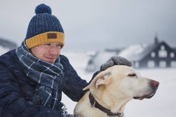 istock Man with dog during frosty winter day 1785906676