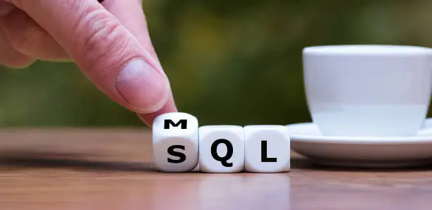 Photo of Dice form the abbreviations MQL (marketing qualified lead) and SQL (sales qualified lead).