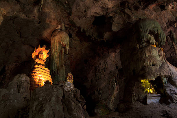 istock Buddha statue coverd with King of naga inside the cave 178590920