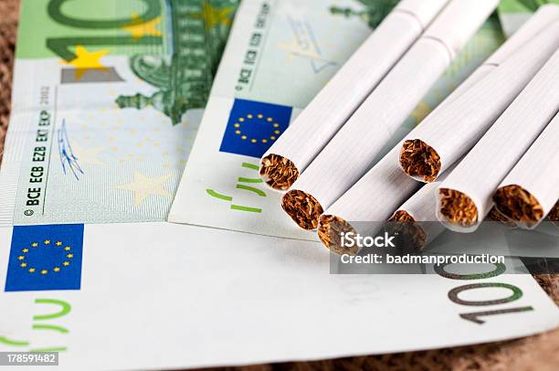 Money And Cigarette Stock Photo - Download Image Now - Cigarette, Addiction, Bad Habit