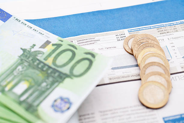 istock Banknotes and coins are on financial newspaper 178591975