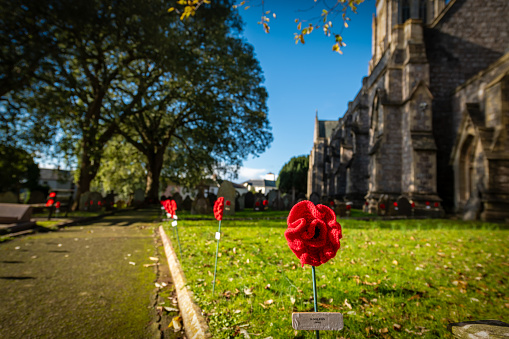 St Marychurch, UK. 10 November 2023. St Mary the Virgin Church in Torquay has knitted poppies lining footpath and armed forced displays to mark Remembrance Day.