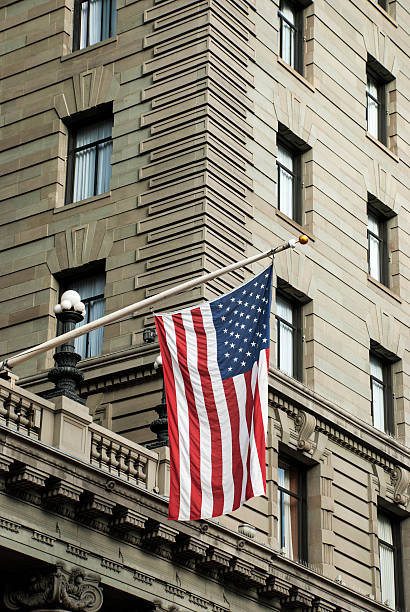 istock USA national flag hanging on a building 178592496