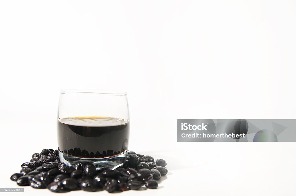 liqueur coffee Photographic composition formed by a glass of liqueur coffee and coffee beans isolated on white.Photographic composition formed by a glass of liqueur coffee and coffee beans isolated on white. Alcohol - Drink Stock Photo