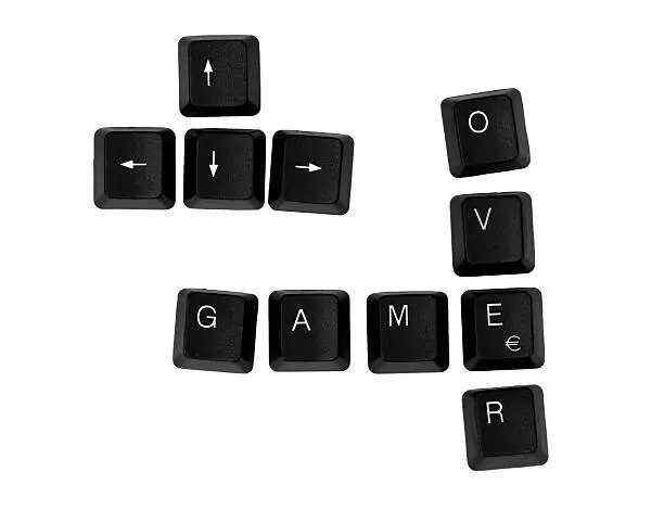 GAME OVER sign written on a keyboard. Isolated on a white background.