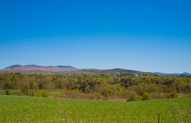 istock Farms Homes Mountains Blue Sky 178594299