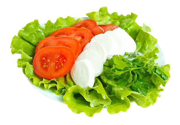 Mozarella cheese with tomato and salad stock photo