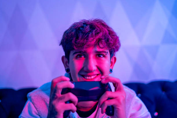 istock Portrait of a young man's face playing a video game from his PC. 1785948789