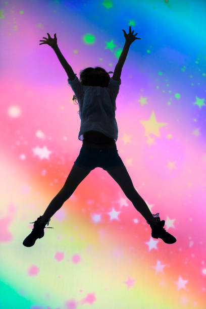 Silhouette of a dancing girl and bokeh.