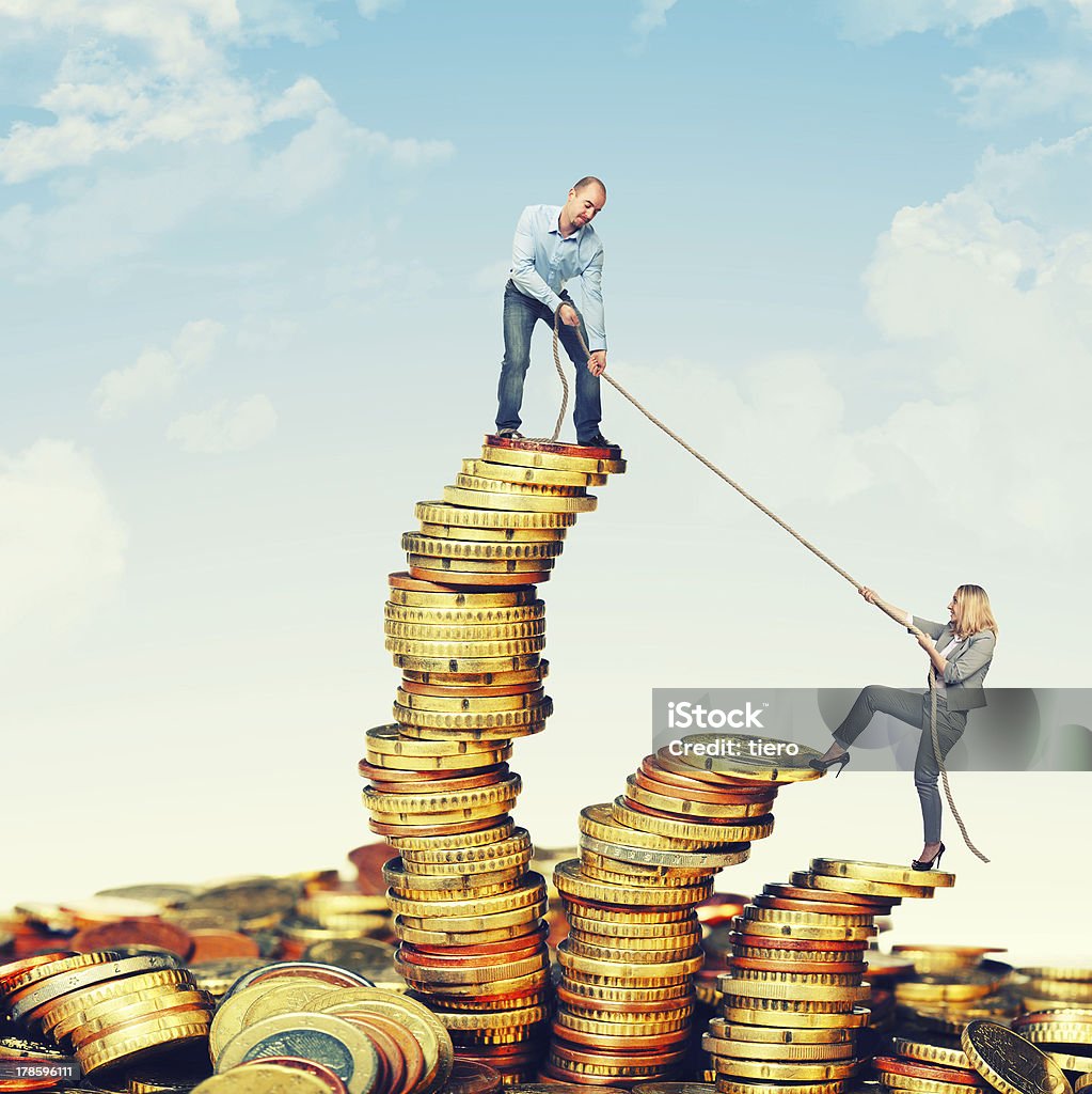 help to get on top business team on euro coin piles Occupation Stock Photo