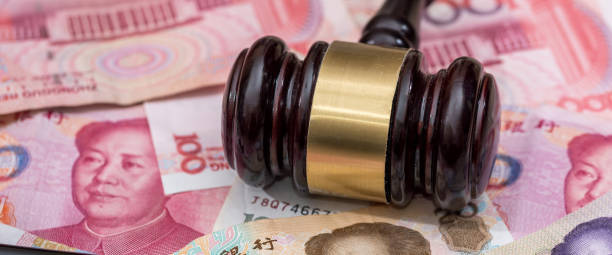 istock yuan on wooden hammer . close up. 1785961970