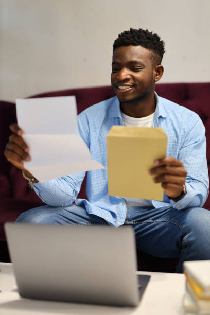 istock Handsome young African American man at home, using a laptop for online communication and education. 1785968252