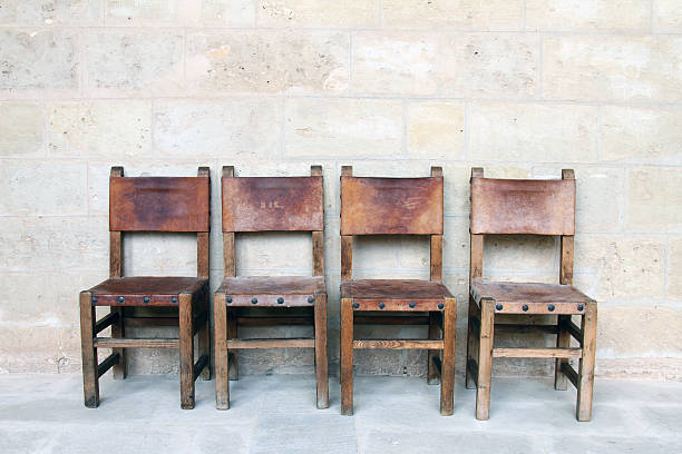 istock vintage chairs at the stone wall 178597653