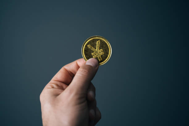 istock Hand holding golden British Pound coin 1785977165